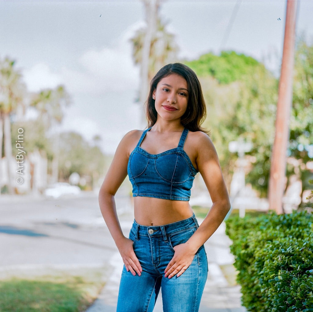 young woman in a denim outfit on a sidewalk shot on Kodak Portra 160 120 film, developed in C-41