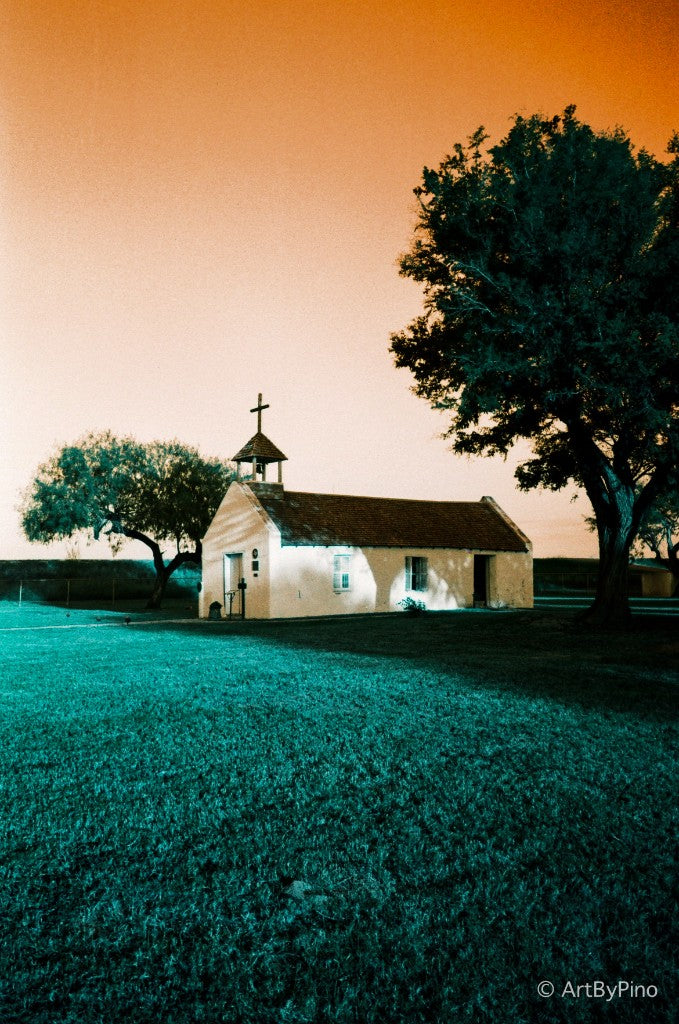 Small white chapel with a wooden cross and shingled bell cupola beside a large tree, La Lomita Chapel, Mission — Lomography LomoChrome Turquoise 35mm, Olympus XA4