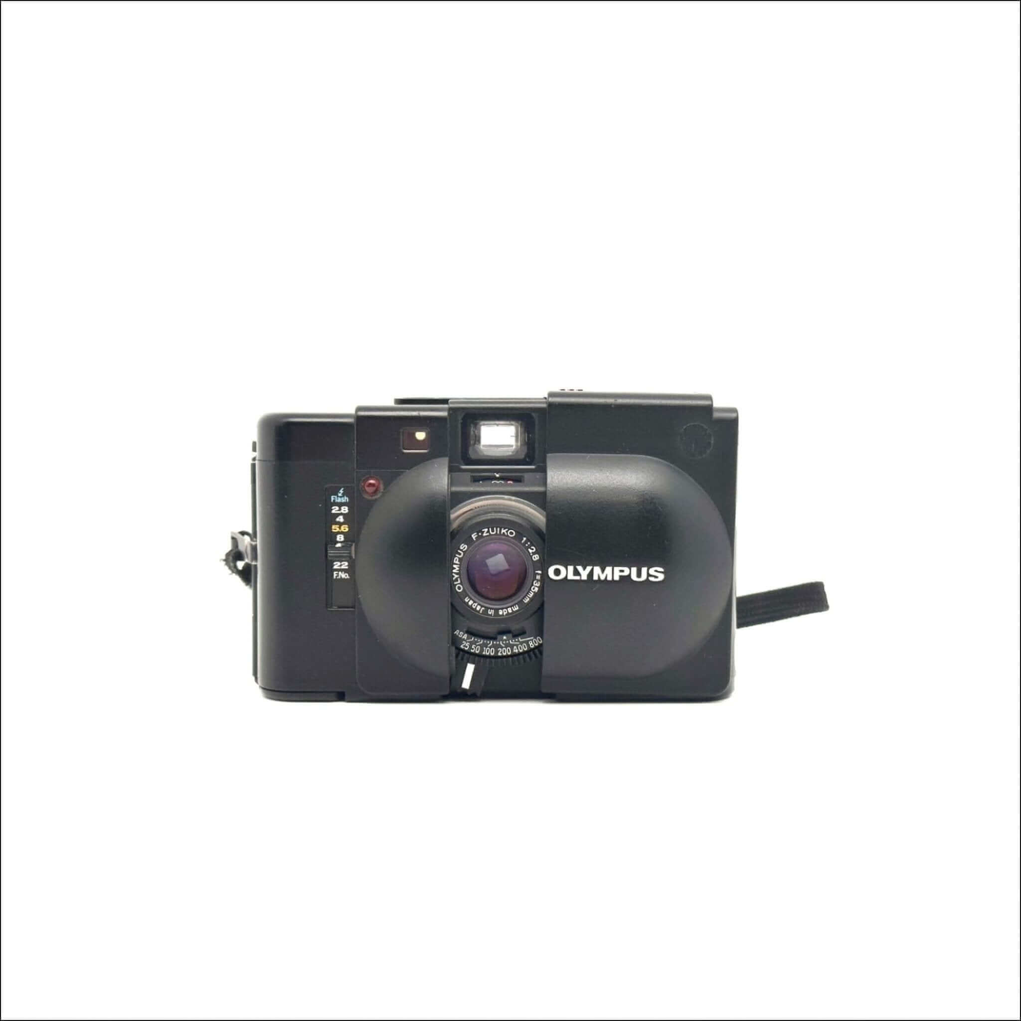 Black olympus c-203 compact camera with a prominent lens and built-in flash.