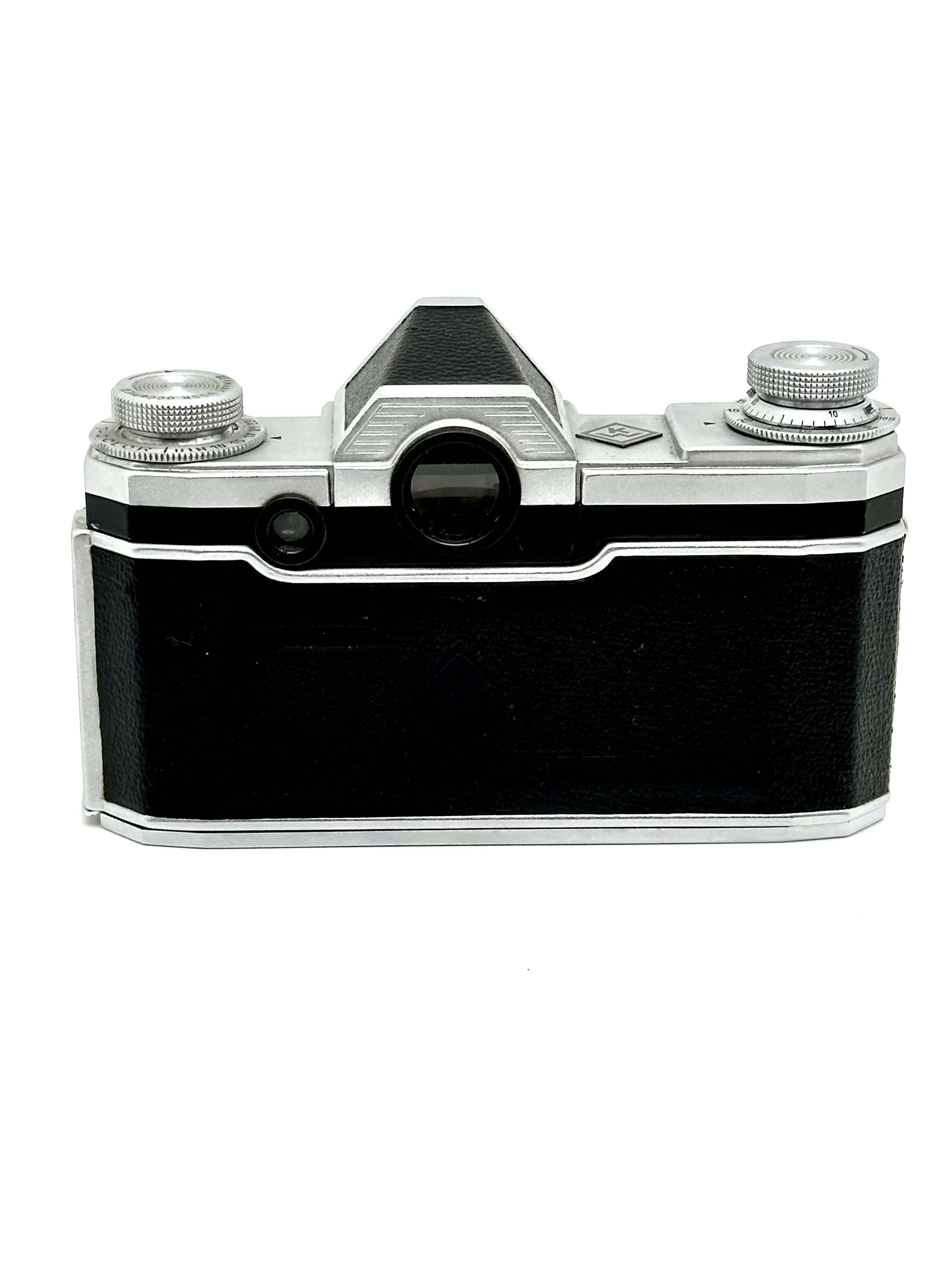 Black leather-bodied camera with silver metal accents and a classic rangefinder design.