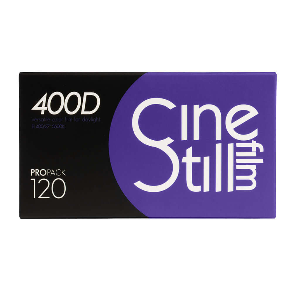 Purple and black cinestill 400d film pack box with white lettering.