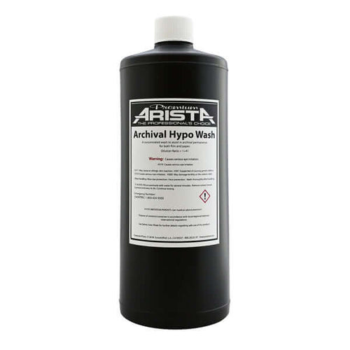 Black plastic bottle with white cap and label reading ’premium arista archival hypo wash.’