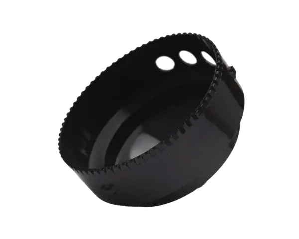 Black metal hole saw with serrated cutting edge and three silver pilot holes
