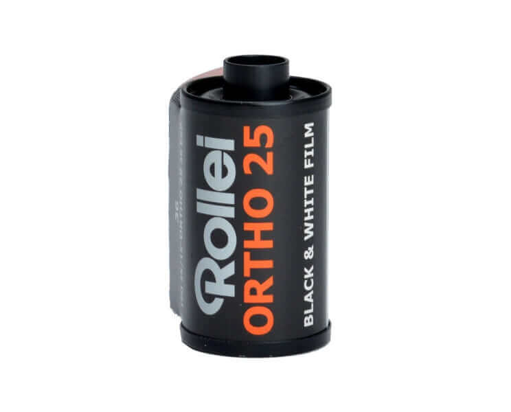 Black rollei ortho 25 black and white film canister with orange and silver text.