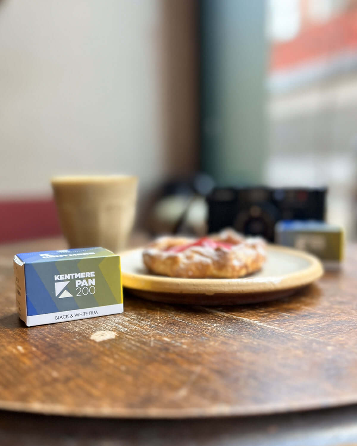 A blue and white box of kentmere pan 200 black-and-white film.