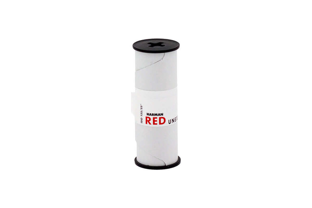 White cylindrical spool with black caps and a red ’harman red’ label, featuring the model number iso 123/722.
