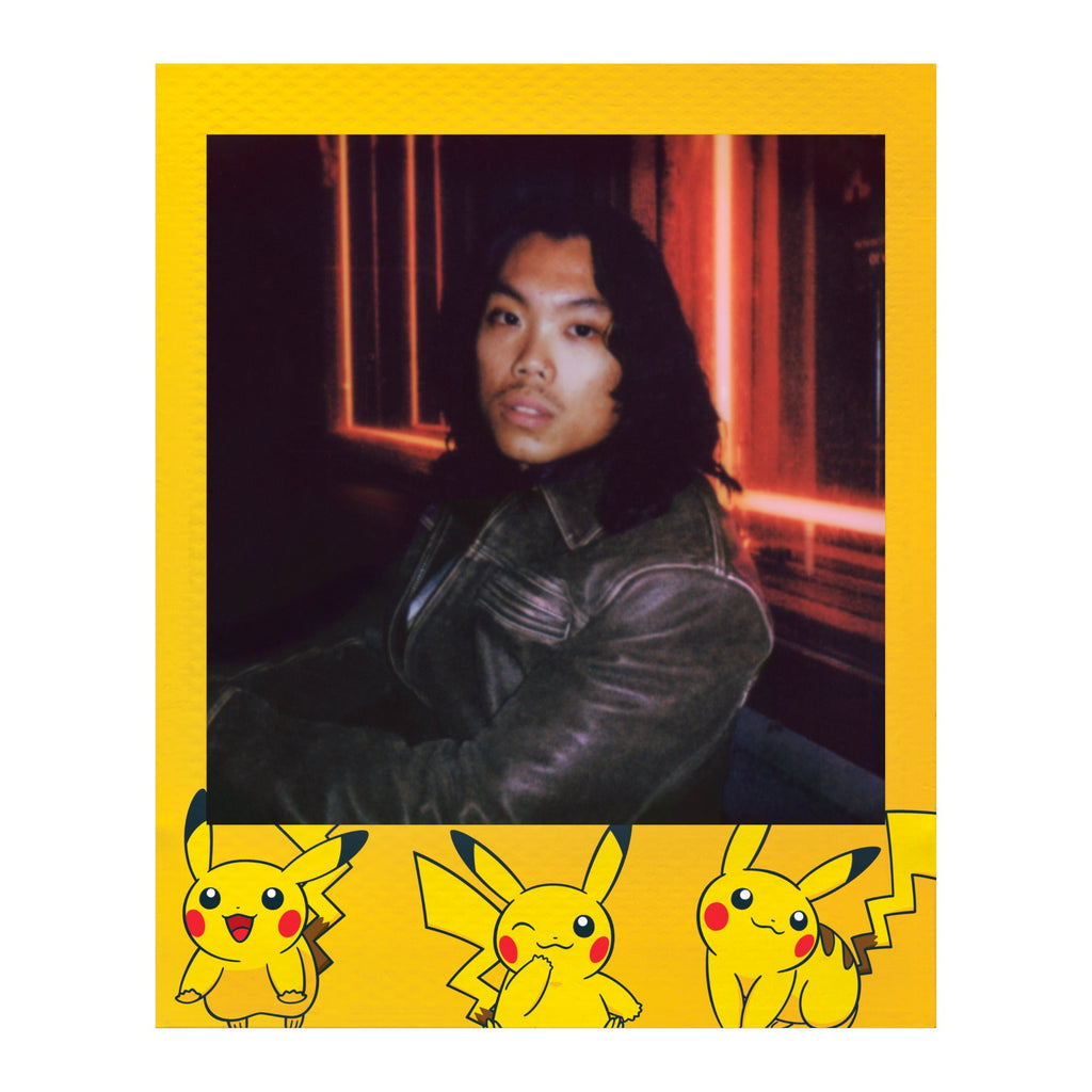 Polaroid Go instant photo in a bright yellow frame with Pikachu artwork