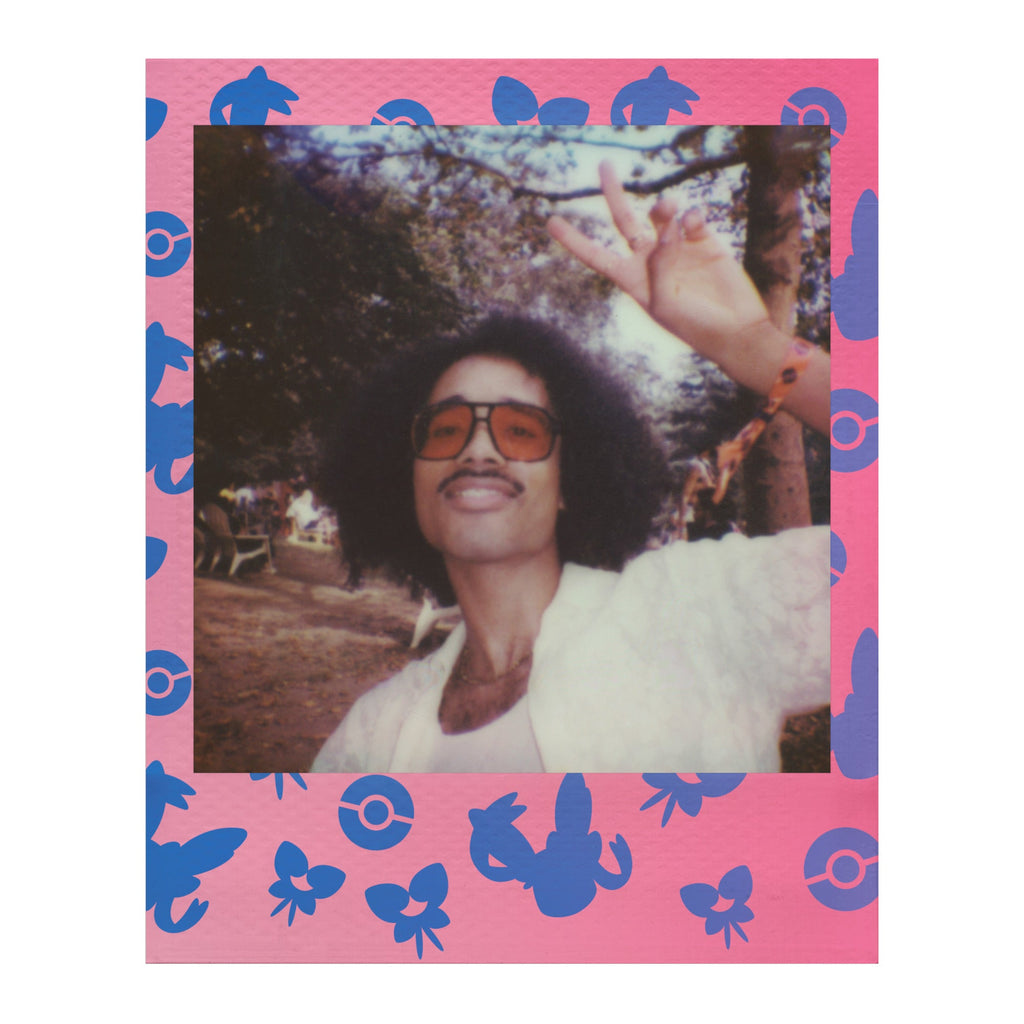 Polaroid Go instant photo in a pink frame with blue Sylveon artwork