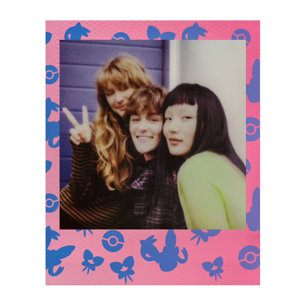 Polaroid Go photo of two friends in a pink Sylveon edition frame