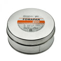 Silver cylindrical canister of fomapan 200 black and white negative film, labeled with orange and black text.
