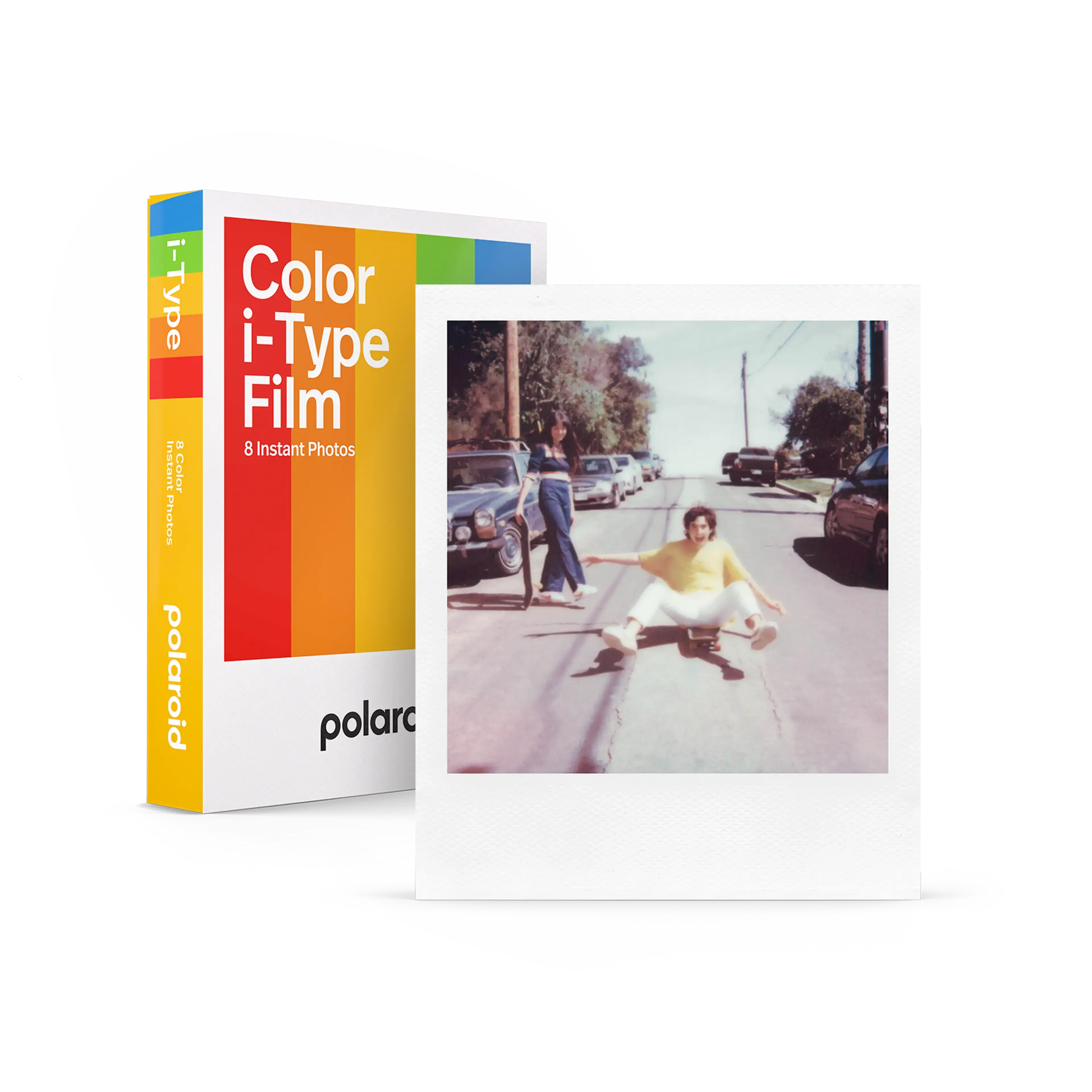 Polaroid color i-type film pack with rainbow-striped box and a sample instant photo of someone in yellow shirt on skateboard.