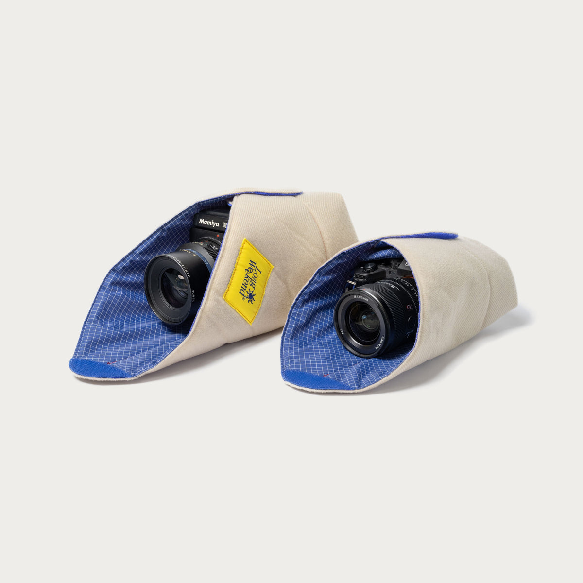 Long Weekend padded camera wraps in 19 x 19 and 16 x 16 inch sizes side by side, each holding a camera