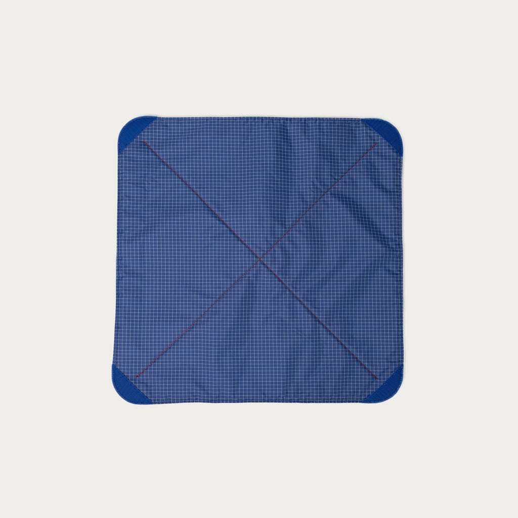 Blue grid nylon ripstop interior of the Long Weekend padded camera wrap with blue velcro corner tabs