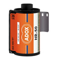 A vibrant orange and white adox hr-50 film canister with black plastic ends, featuring a distinctive blue stripe design.
