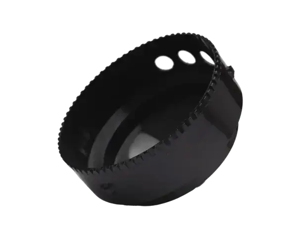 Black metal hole saw with serrated cutting edge and three silver pilot holes
