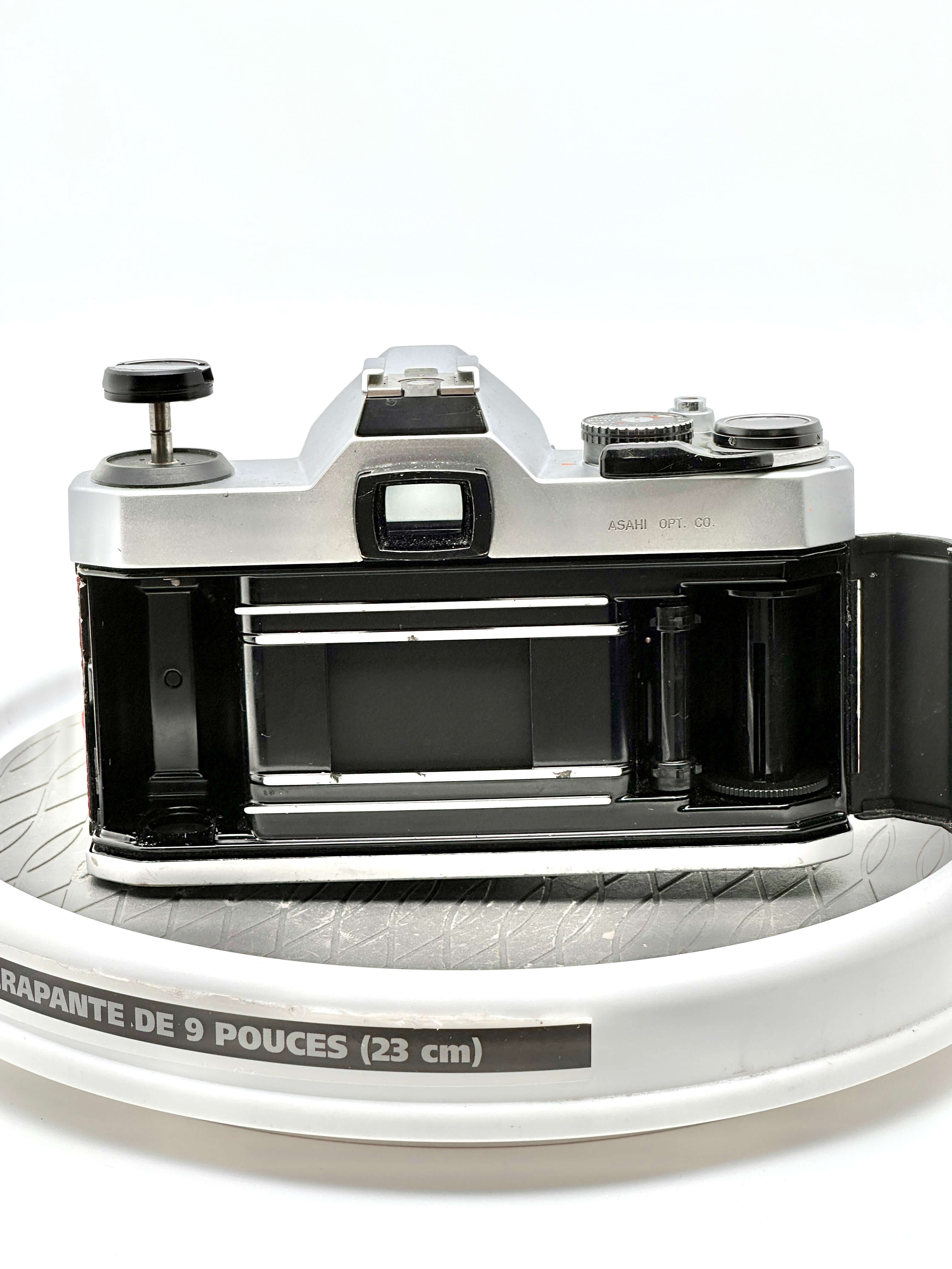 Silver-bodied, vintage asahi pentax 67 camera with black accents and a classic rangefinder design.