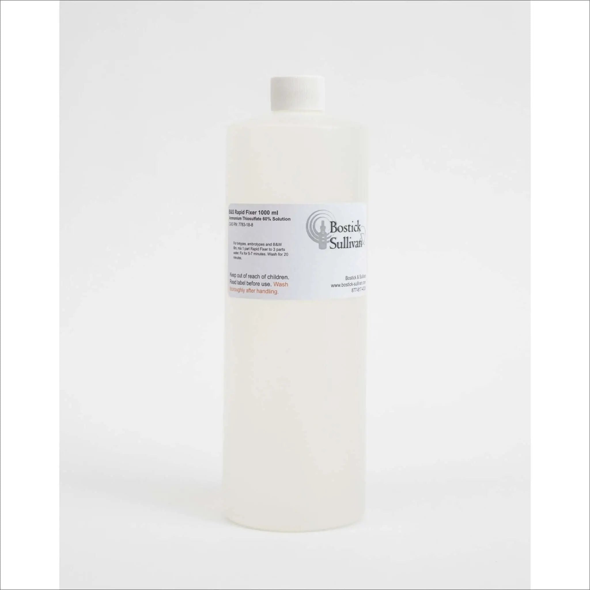 A translucent white plastic bottle with a white cap, labeled ’bostick sullivan’ and marked as containing 1000 ml of bsi rapid fixer solution.