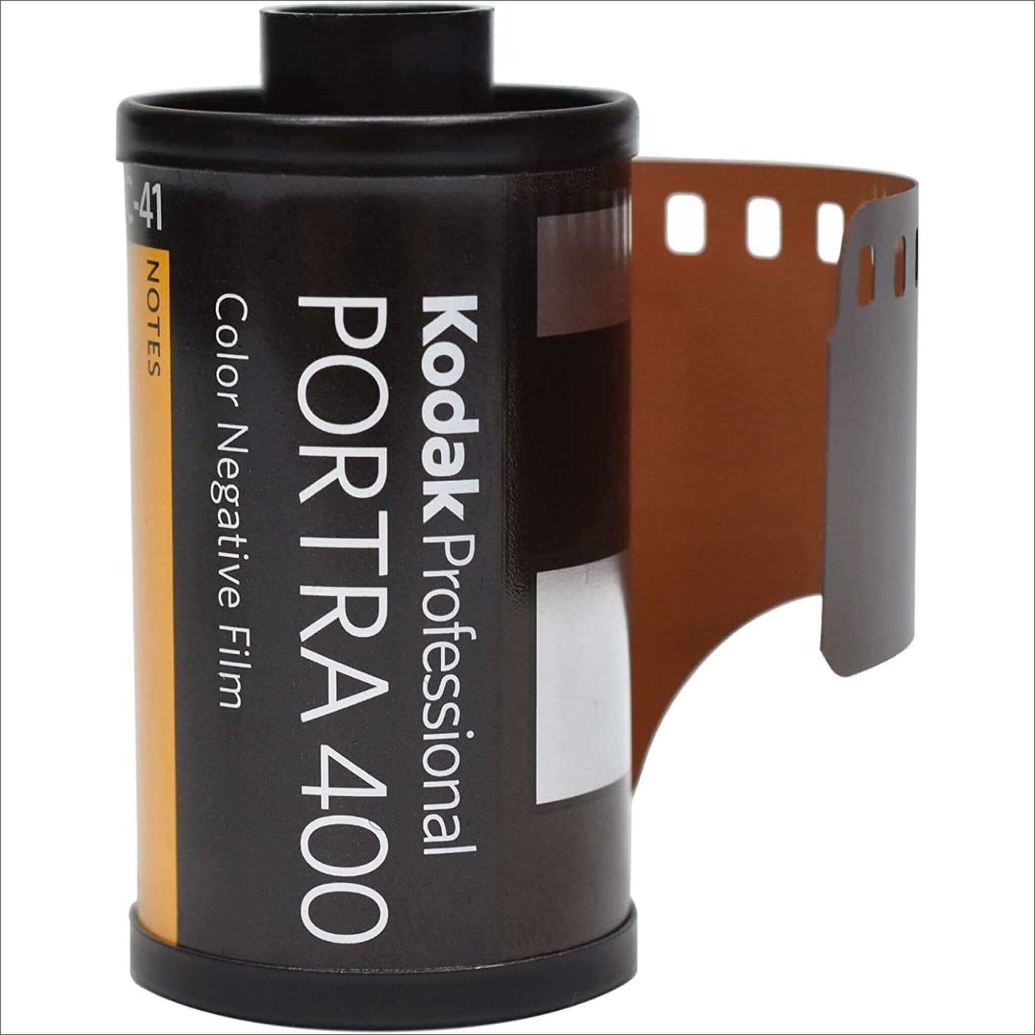 Black kodak professional portra 400 color negative film canister with a partially exposed brown photographic strip.