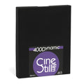 Black rectangular box with a purple and white label featuring the ’400dynamic cinestill’ branding, indicating it contains 25 sheets of 4x5 film.
