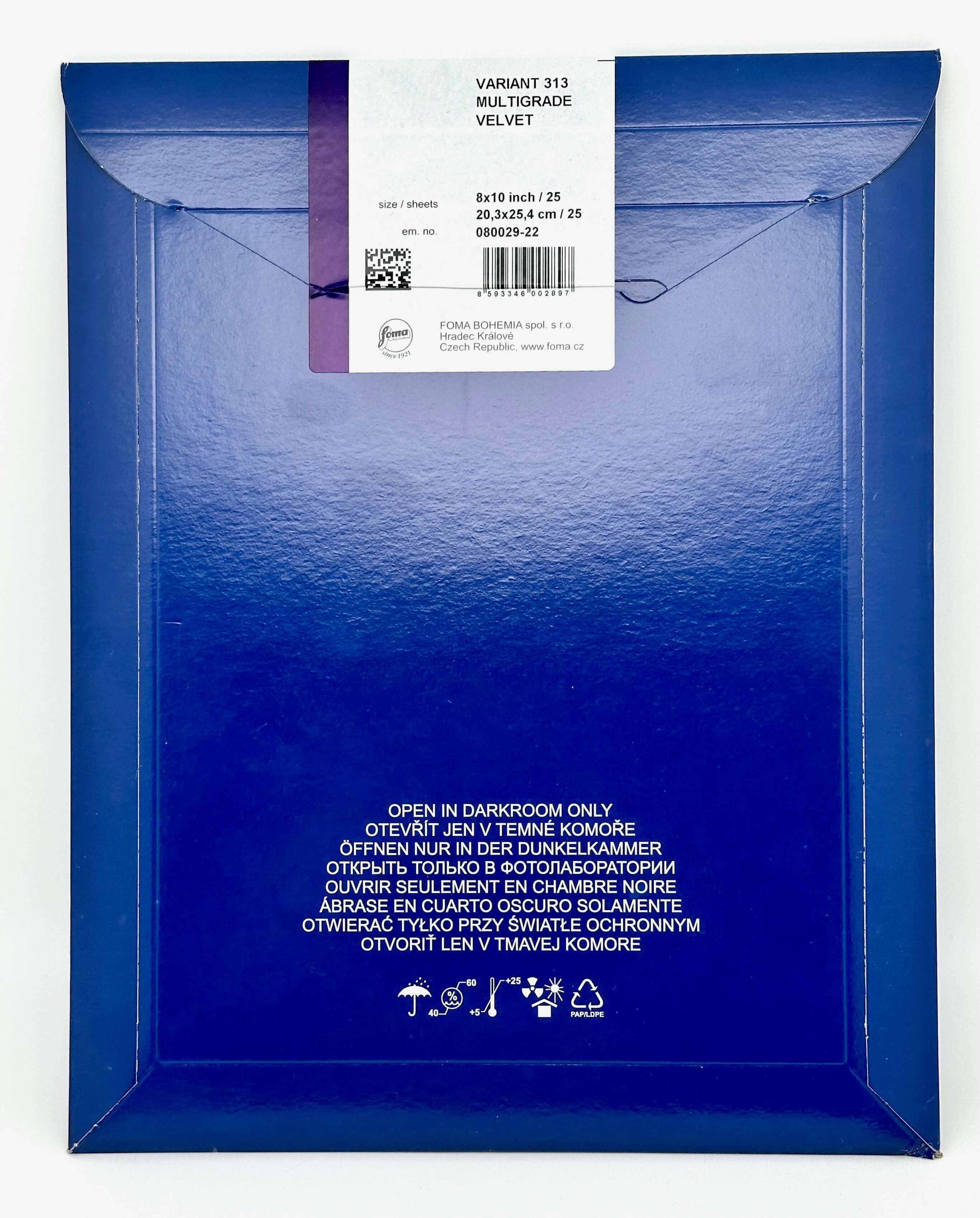 Deep blue multigrade velvet envelope with a white label and barcode.