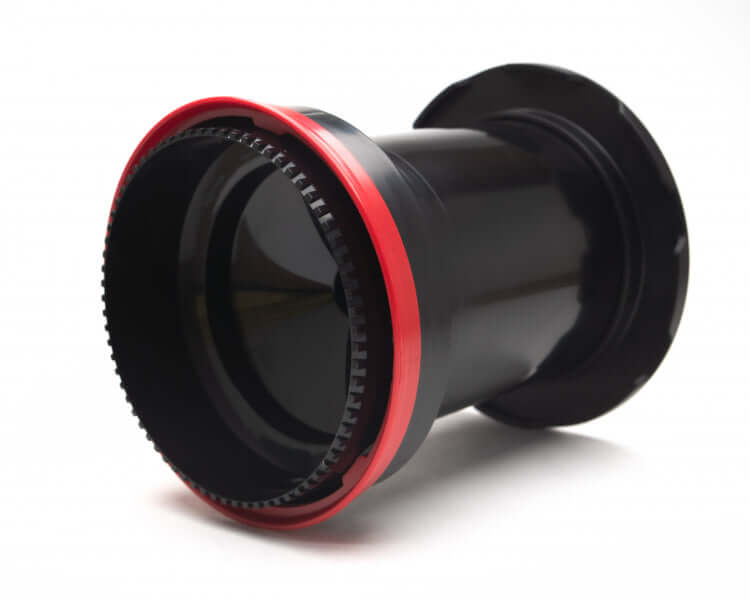 Black and red bicycle bottom bracket with a textured outer ring.