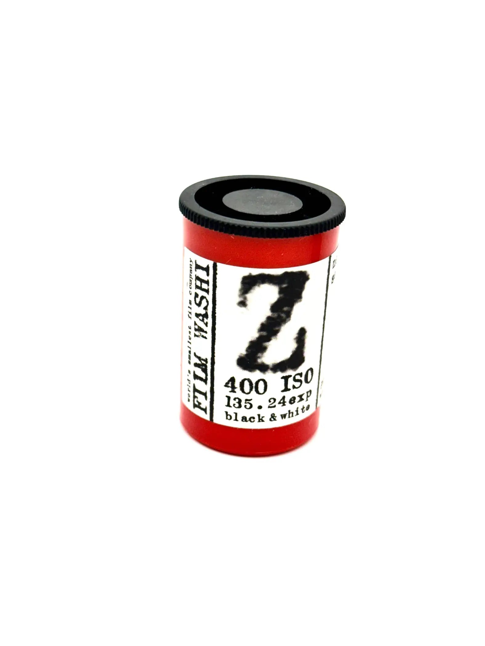 Red cylindrical film canister with black cap and white label featuring bold ’z’ branding, marked as 400 iso for black & white photography.