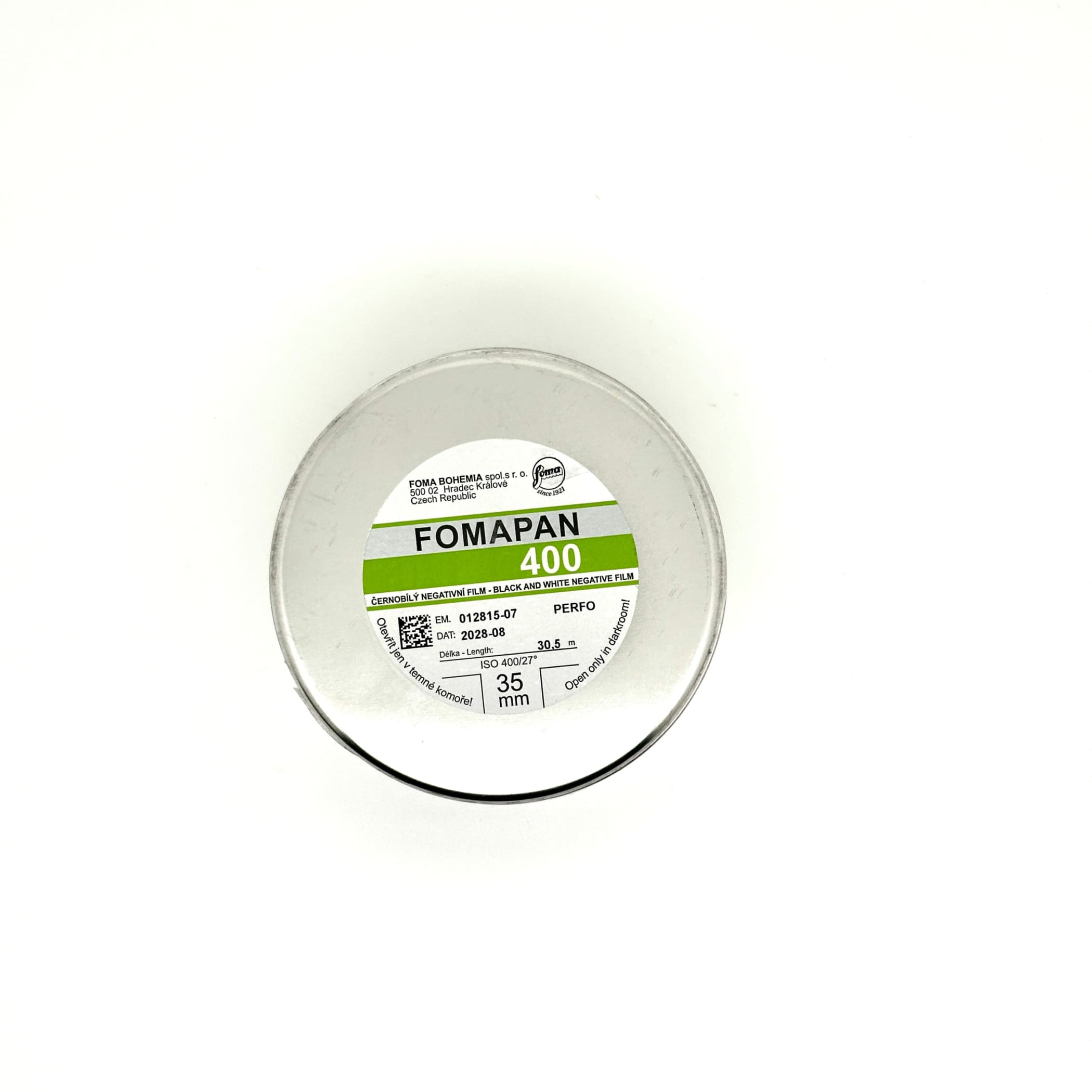 A circular container of fomapan 400 black and white negative film, featuring a clear plastic lid with printed specifications on its label.