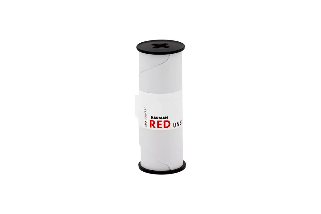 White cylindrical spool with black caps and a red ’harman red’ label, featuring the model number iso 123/722.