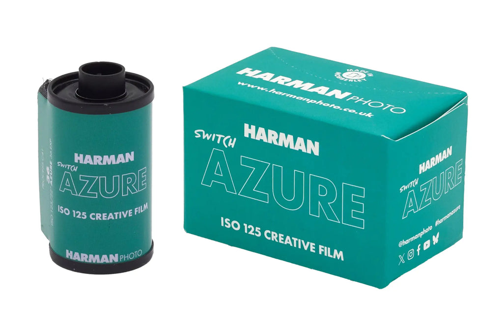 Teal-colored harman azure iso 125 creative film roll with black caps and white lettering.