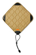 Tan quilted kodak camera strap with black leather accents and a drawstring closure.