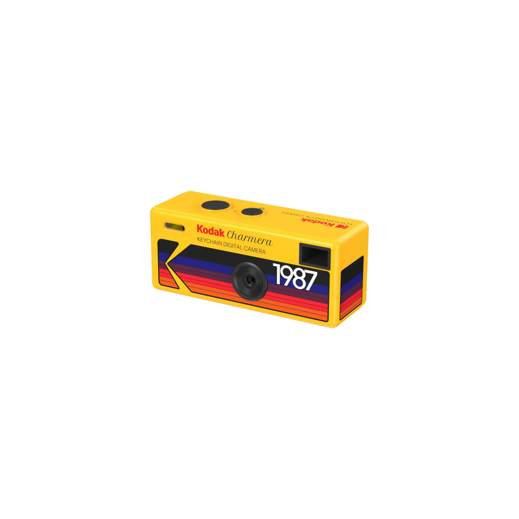 Vibrant yellow kodak charmera keychain digital camera featuring a retro 1987 design with bold red, blue, and orange stripes.