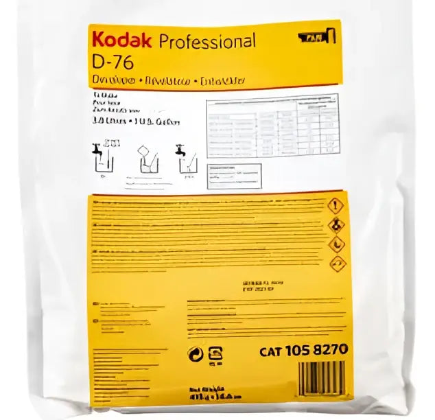 Kodak professional d-76 developer solution in a white and yellow plastic bag with printed instructions.