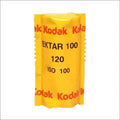 Yellow kodak ektar 100 film roll, iso 100, in a classic cylindrical package with red and black text.