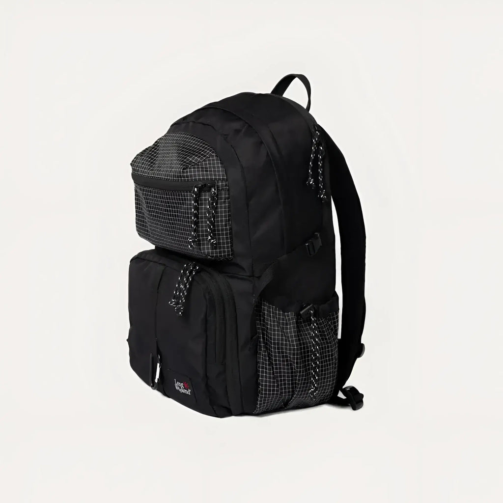Black eastpak backpack with a grid-patterned mesh panel and zipper pulls.