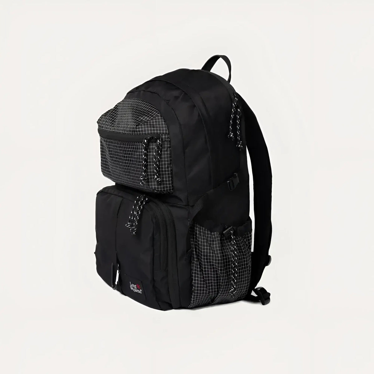 Black eastpak backpack with a grid-patterned mesh panel and zipper pulls.