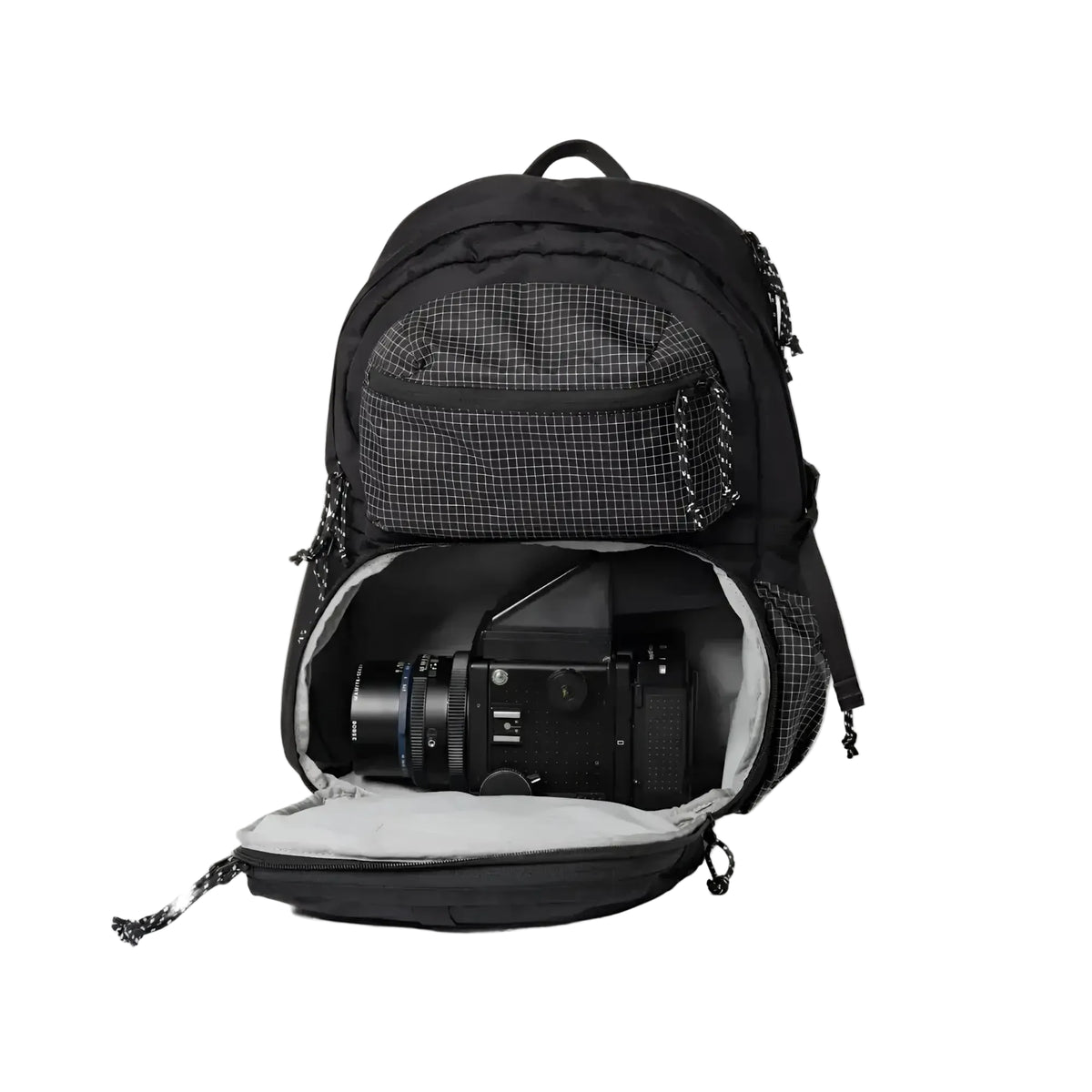Black backpack with a grid-patterned front pocket and interior, designed to securely hold camera gear.