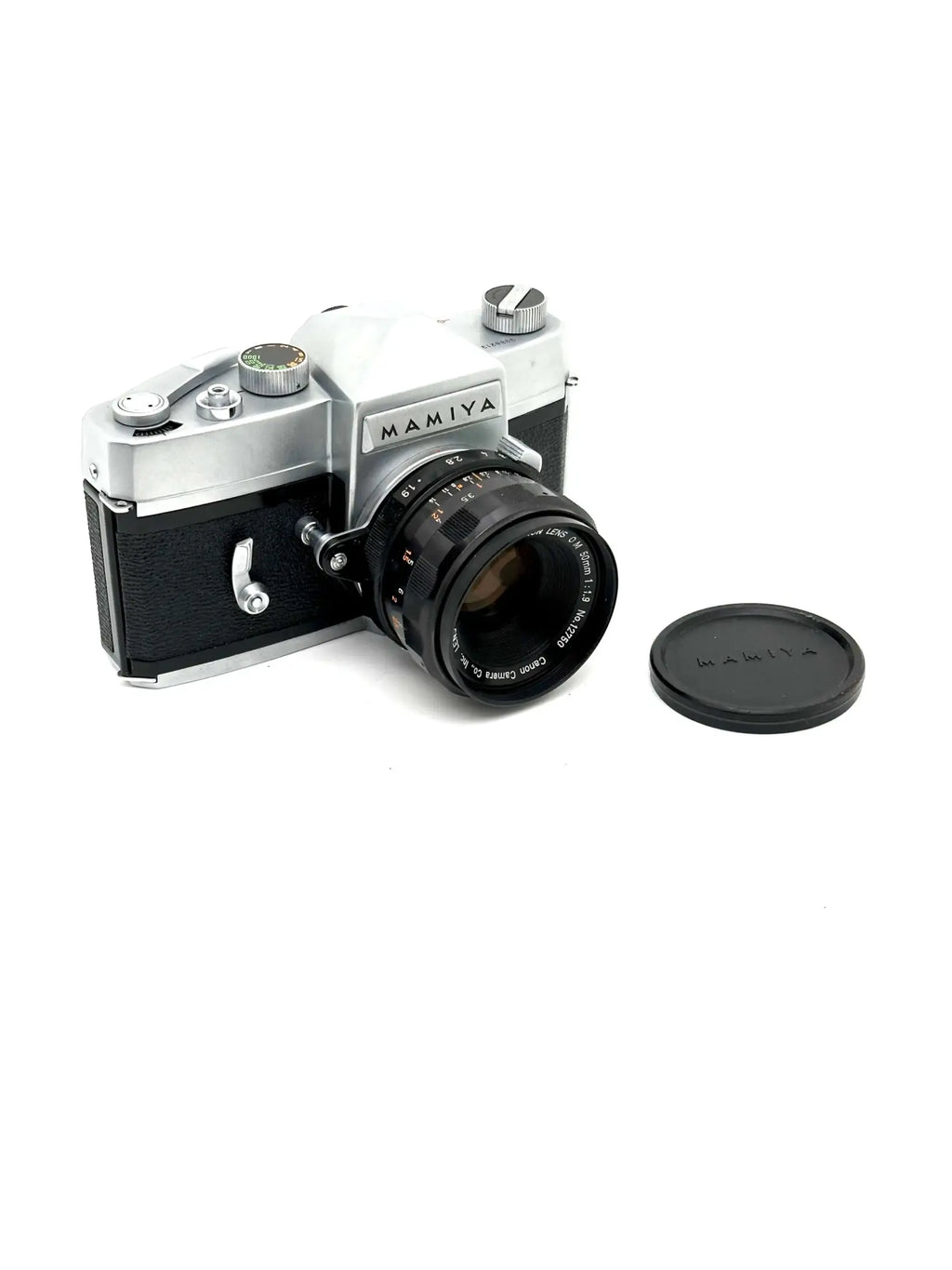 Silver and black mamiya film camera with a mounted lens.