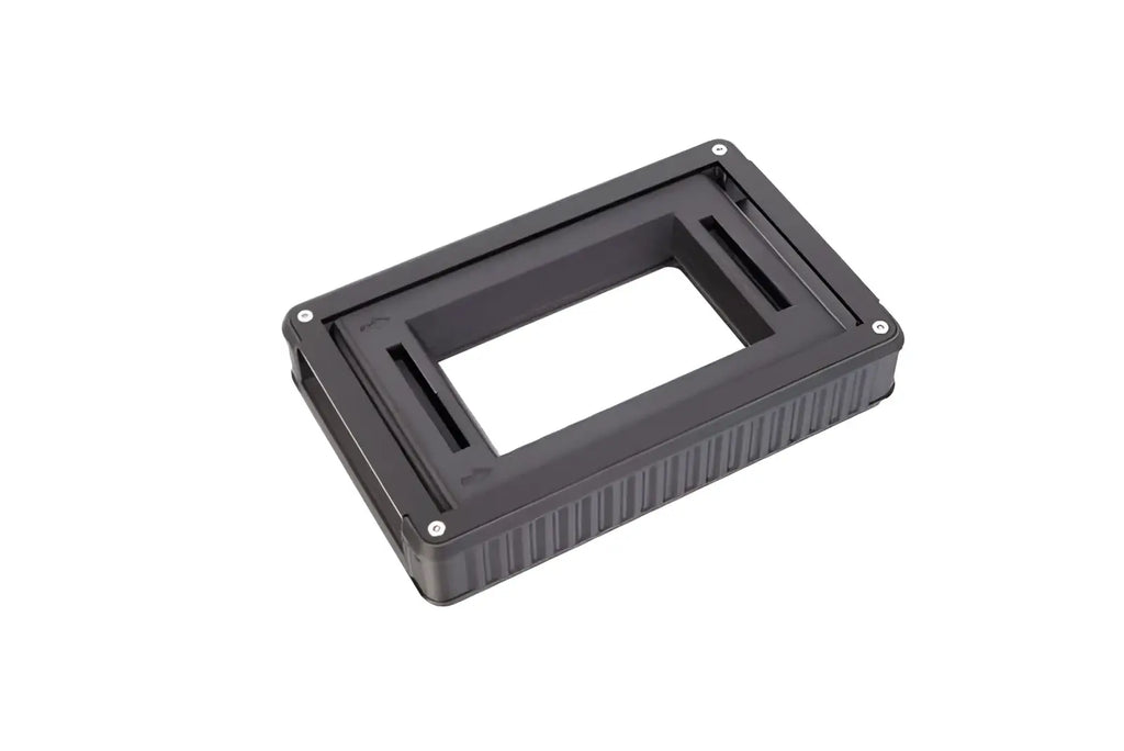 Black plastic lens adapter with textured sides and silver screws.