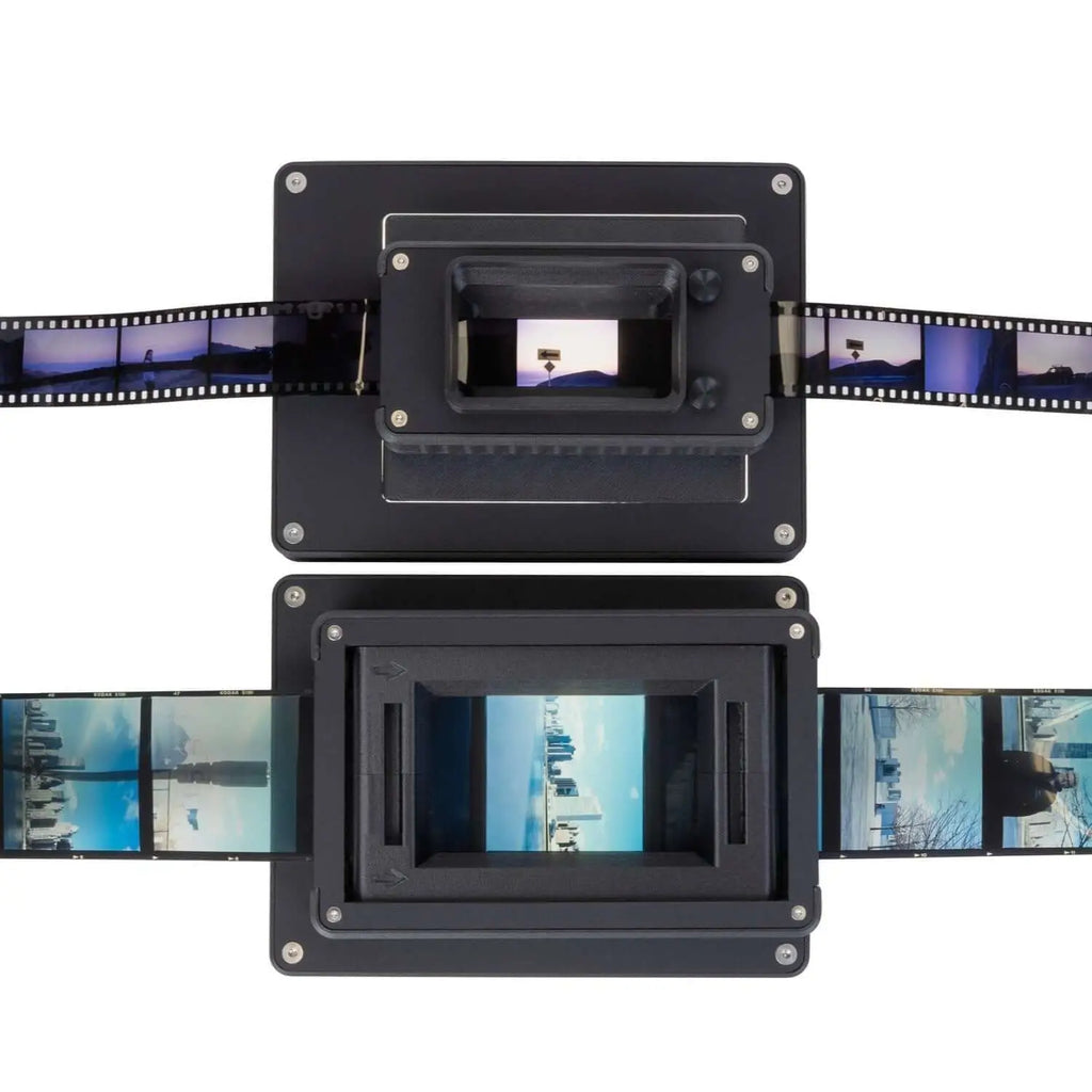 Black film scanner with two rectangular scanning units, each displaying a strip of photographic negatives.