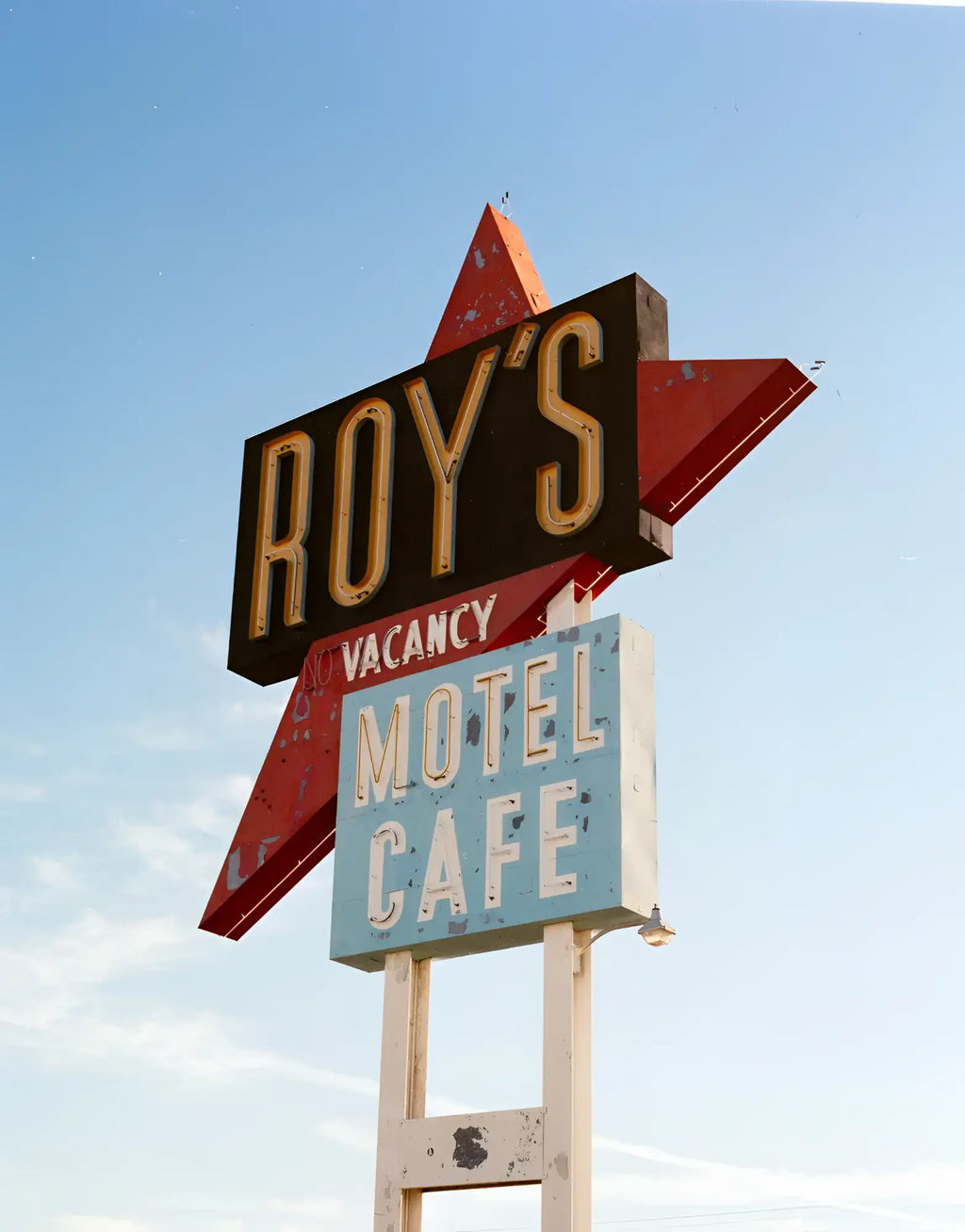 Weathered retro motel cafe sign captured on optik oldschool opticolour 200 c41 color negative film 4x5 25 sheets