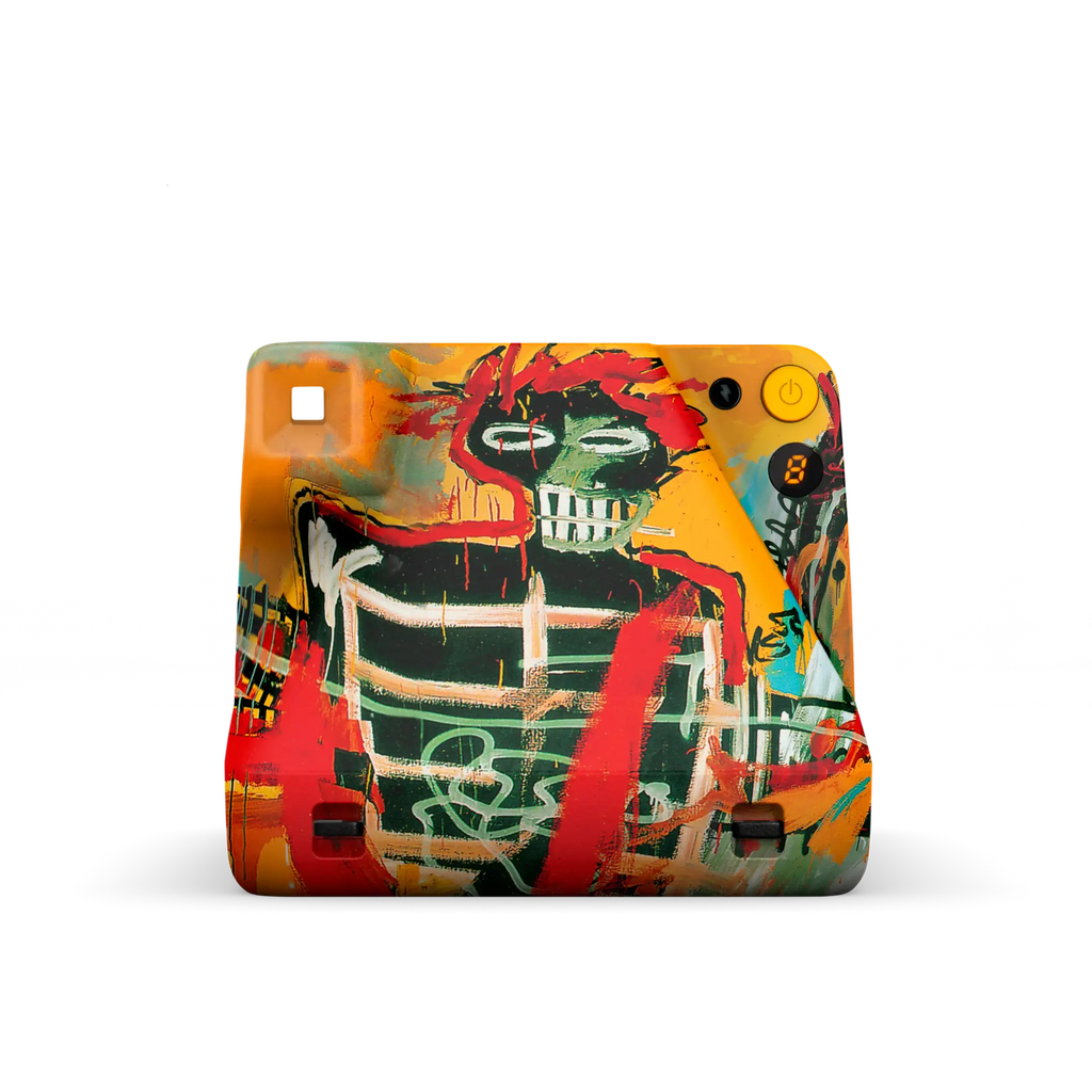 Vibrant graffiti-style camera skin featuring bold red, green, and orange splashes over a stylized skull design.