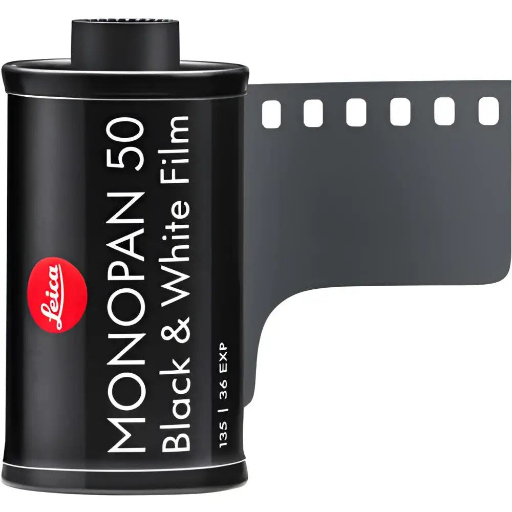 Black leica monopan 50 black & white film canister with a perforated film strip extending from the side.