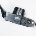 Reflx Lab Digital Light Meter on top of a camera, displaying measurements for accurate exposure settings.