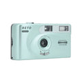 Mint green plastic compact camera with silver accents and ’reto pano’ branding.